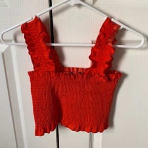 Bright orange crop top